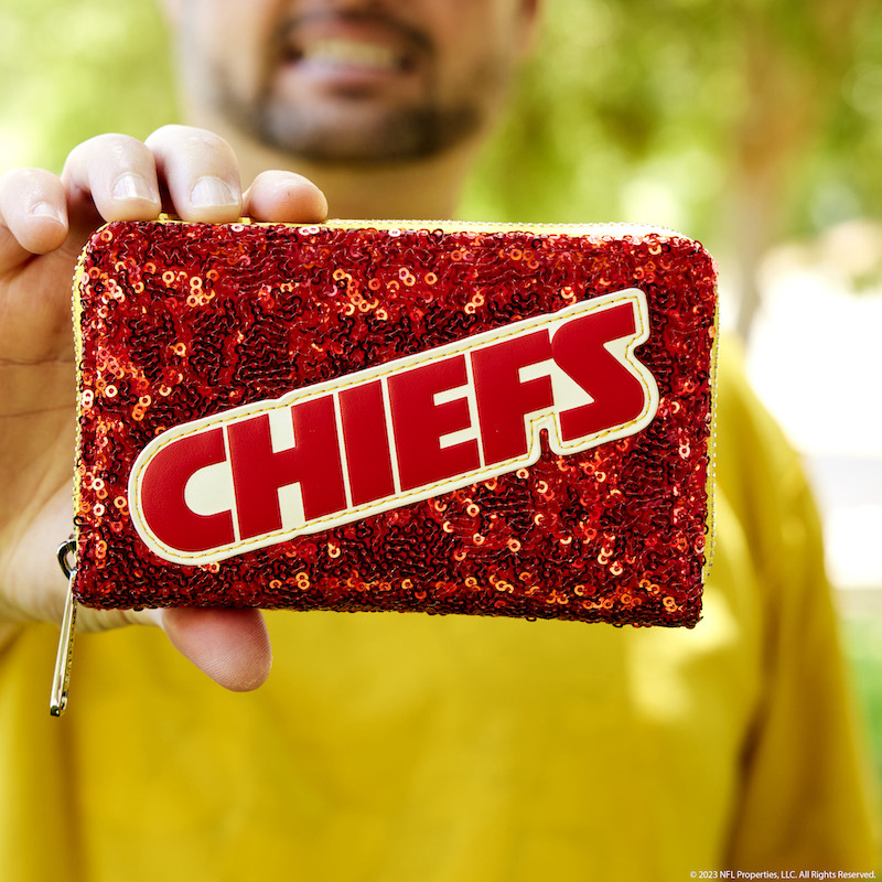 Image of man holding the NFL Kansas City Chiefs Sequin Wallet toward the camera 